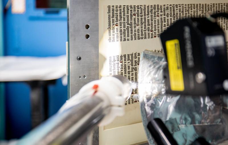 A page of the Gutenberg Bible from 1450-1455 AD is prepped before being scanned at SSRL beamline 7-2. 