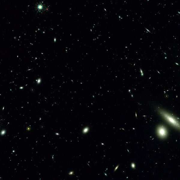 Stars and galaxies on a black background.